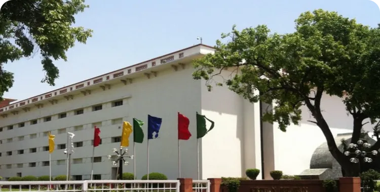 The entrance to Vigyan Bhawan with flags.